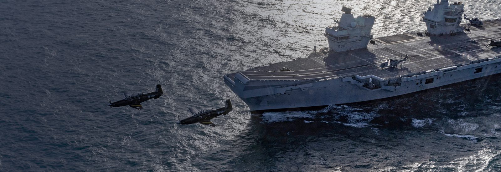 Aircraft flyby a carrier at sea