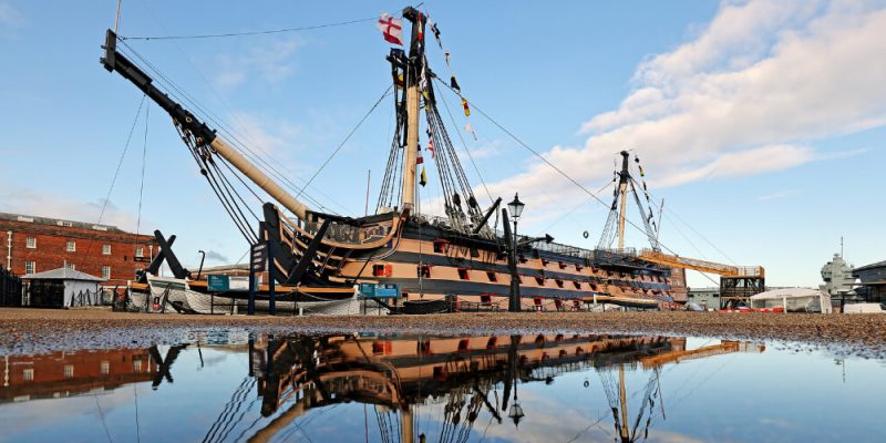 historic wooden ship with cannon bays